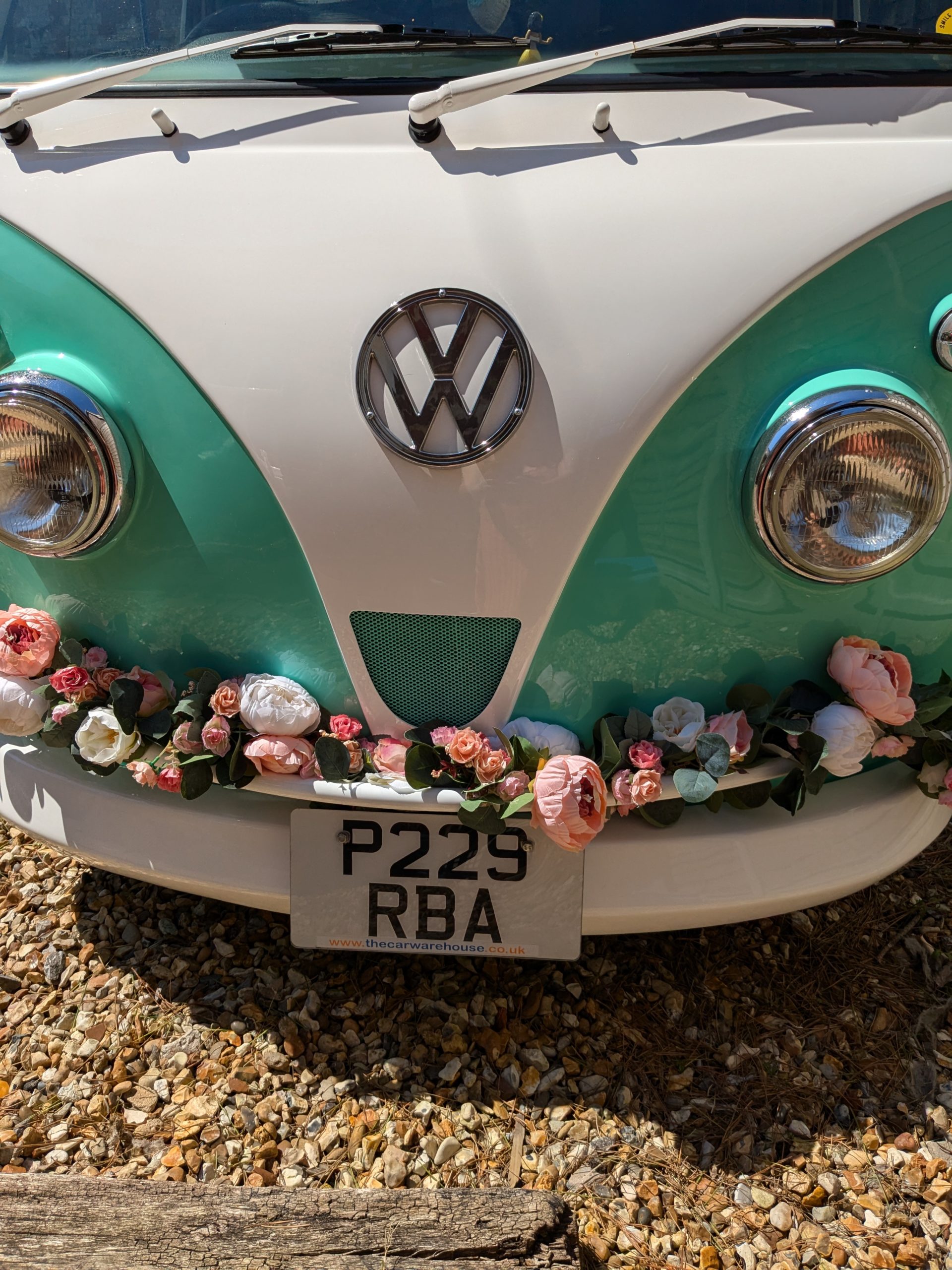 Front view of Etty our Campervan decorated with wedding flowers.